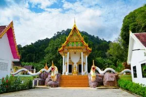 Thai Buddhist temple with golden roof and naga stairway visited on the Phang Nga Bay tour