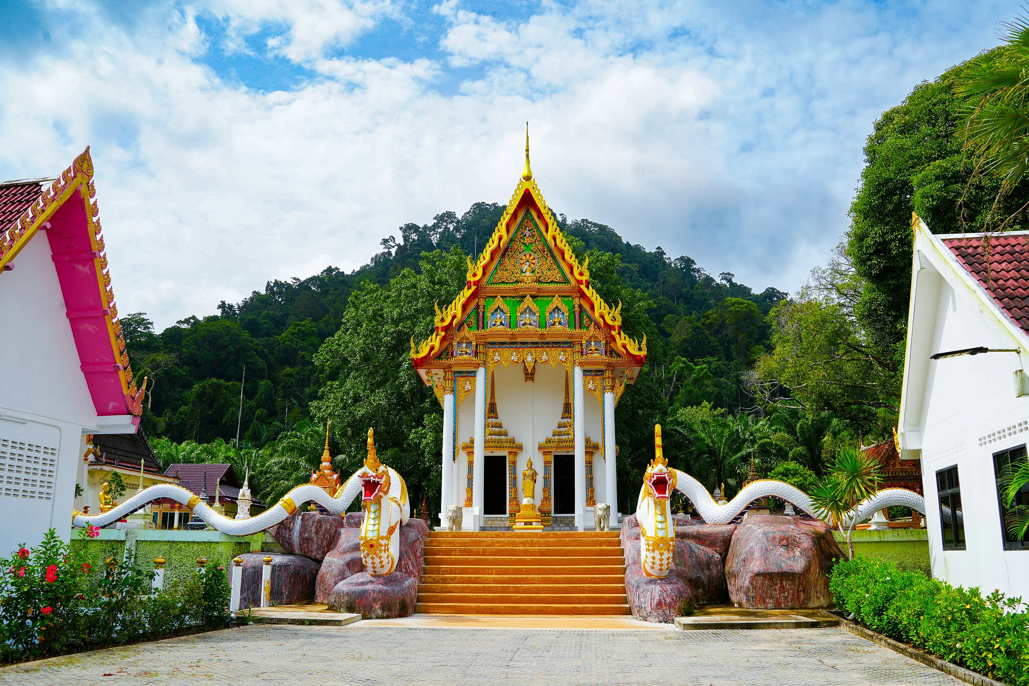 Thai Buddhist temple with golden roof and naga stairway visited on the Phang Nga Bay tour