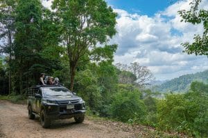 4x4 pickup with guests on a mountain track above the rainforest on the Khao Lak Off-Road Safari