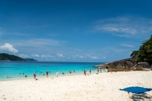 Powder-white sand beach and turquoise water under a blue sky on the Similan Islands, Andaman Sea