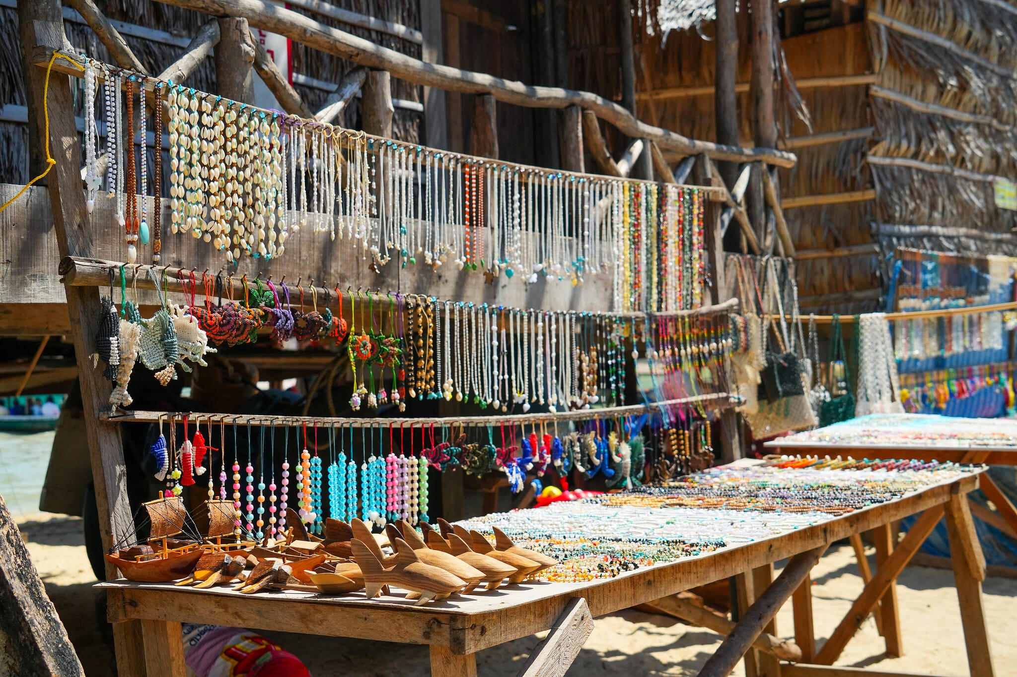 Shell necklaces and handmade souvenirs for sale at a Moken village stall on the Surin Islands