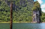 Emerald green lake surrounded by limestone karsts in Khao Sok