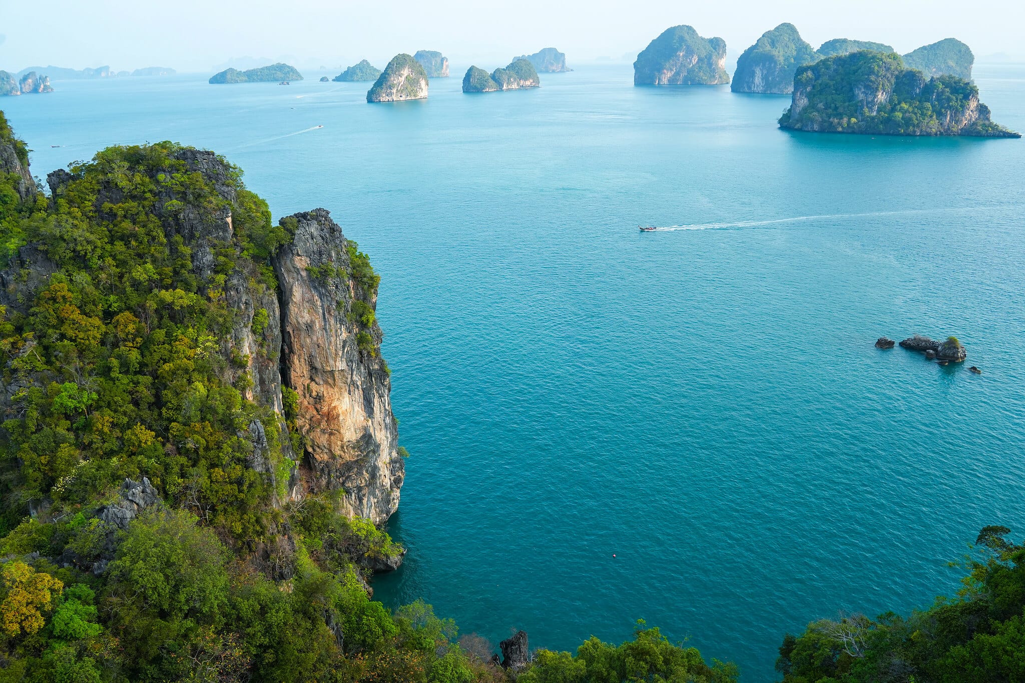Limestone islands scattered across the blue Andaman Sea, seen from the Koh Hong viewpoint, Krabi