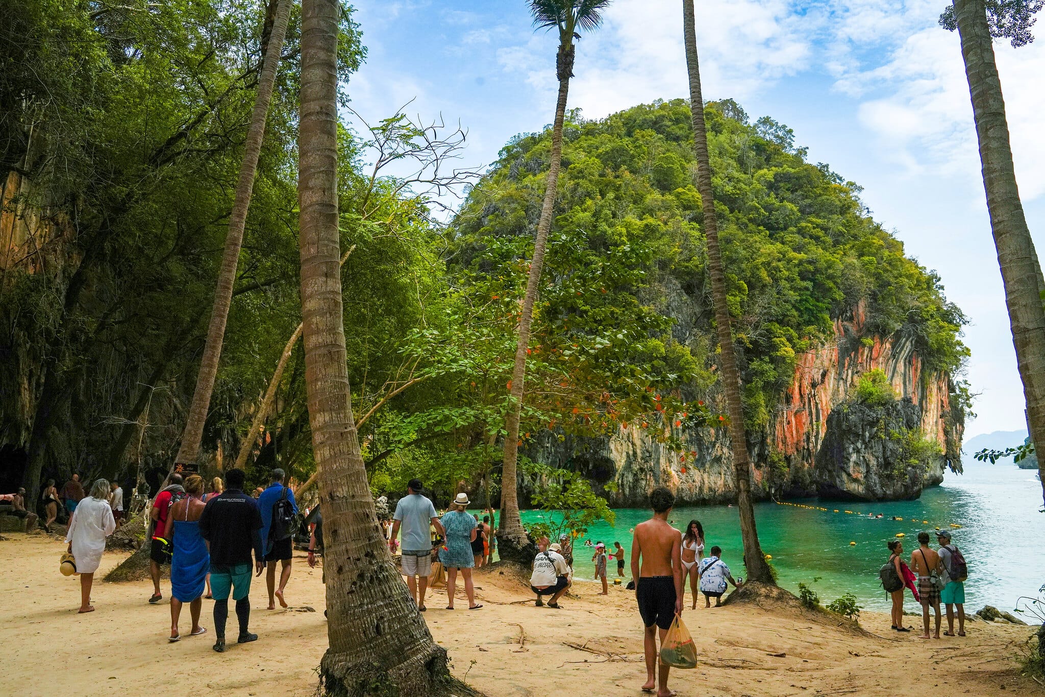 Palm-lined beach and limestone cliff on Koh Hong, a stop on the Krabi 4 Island Tour from Khao Lak