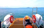 Guests relaxing on the catamaran's sun deck
