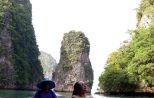 Canoeing beside limestone karsts in Phang Nga Bay