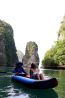 Canoeing beside limestone karsts in Phang Nga Bay