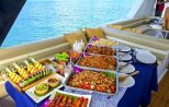 Gourmet dish elegantly presented aboard the catamaran cruise