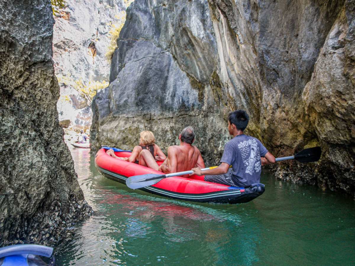 Sea-Canoe Gliding Into A Hidden Lagoon And Sea Cave In Phang Nga Bay