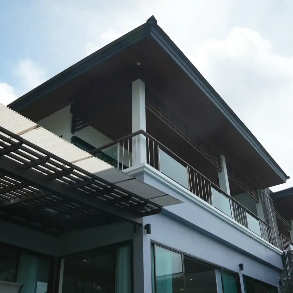 Modern villa architecture with pitched roof and pergola