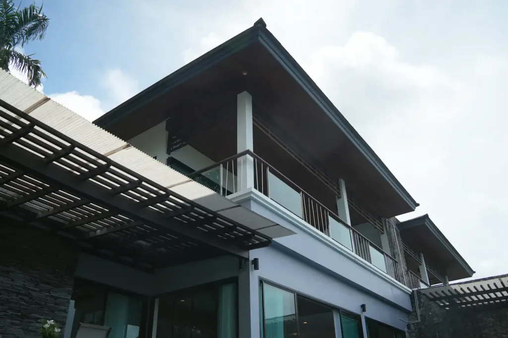 Modern villa architecture with pitched roof and pergola
