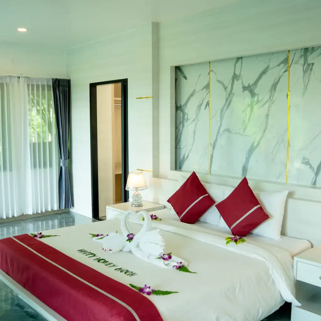 Bedroom with marble feature wall and garden doors