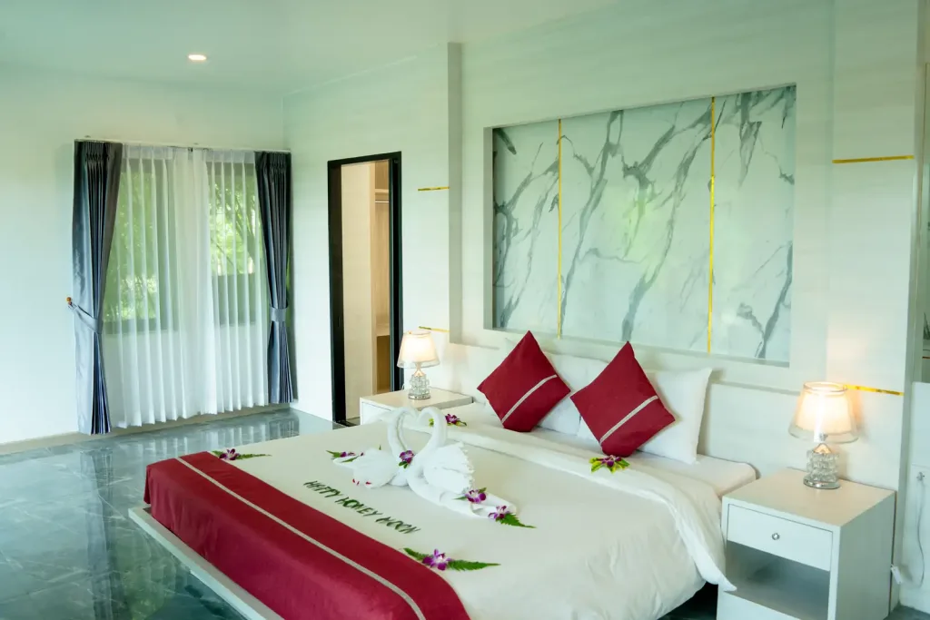 Bedroom with marble feature wall and garden doors