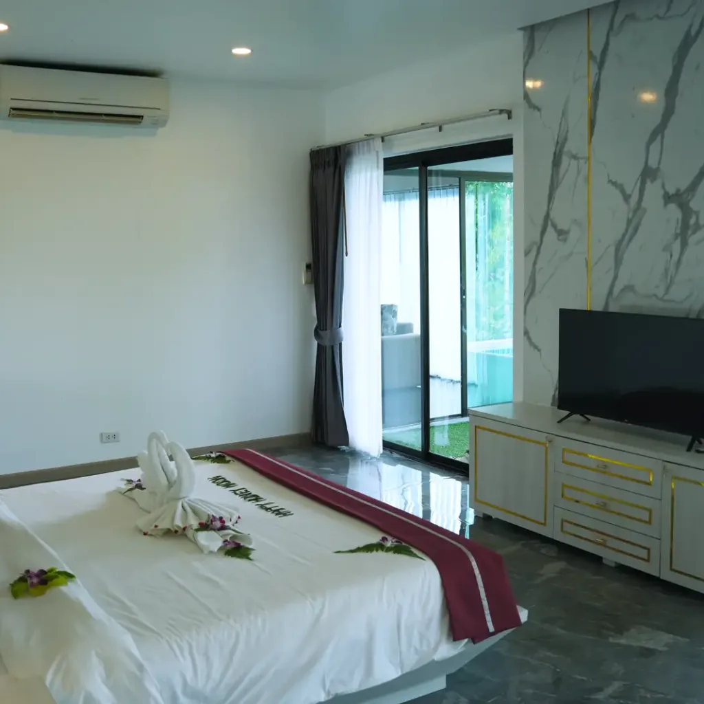Bedroom with marble wall, TV and garden access