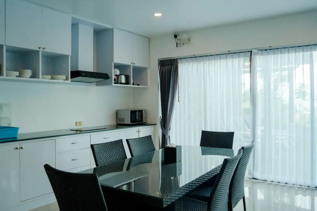 Open-plan kitchen and dining area with garden doors
