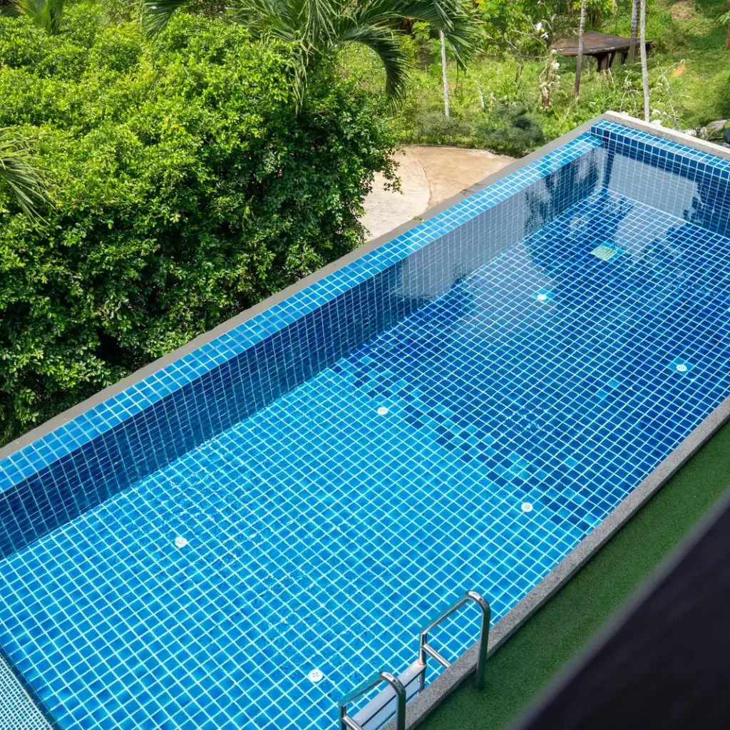 The blue-tiled lap pool seen from above