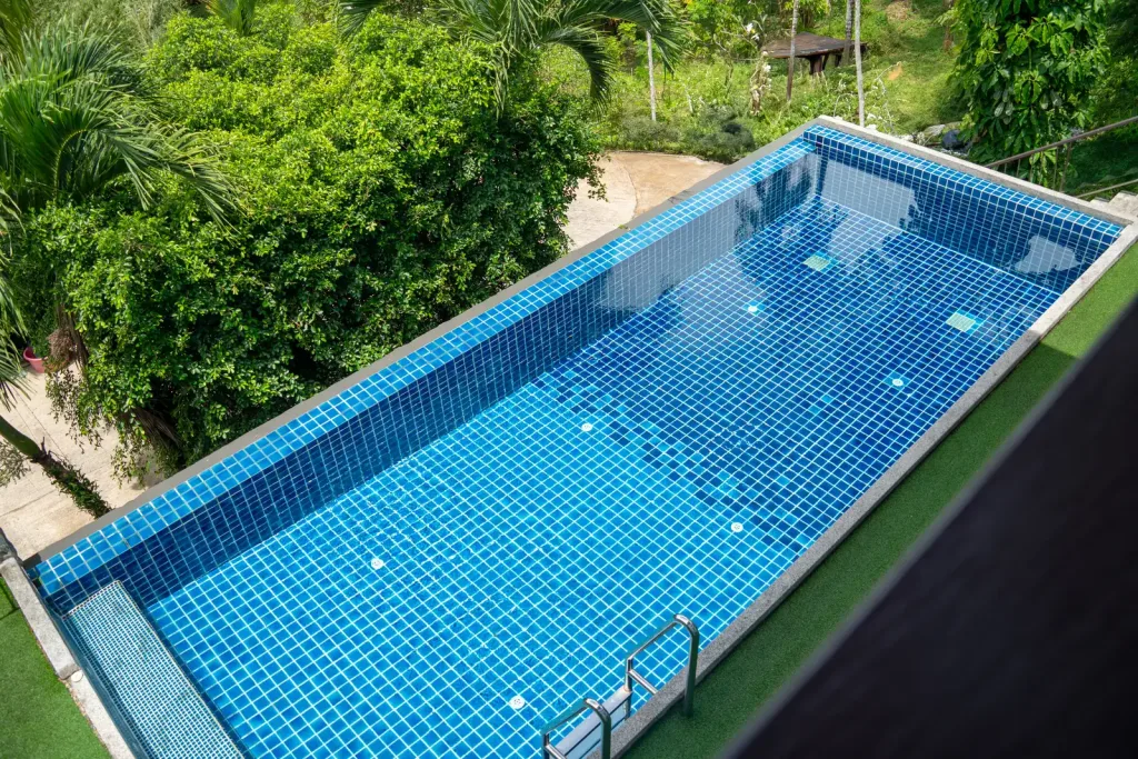 The blue-tiled lap pool seen from above