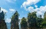 The three iconic limestone pinnacles rising straight out of the green water of Cheow Lan Lake in Khao Sok National Park