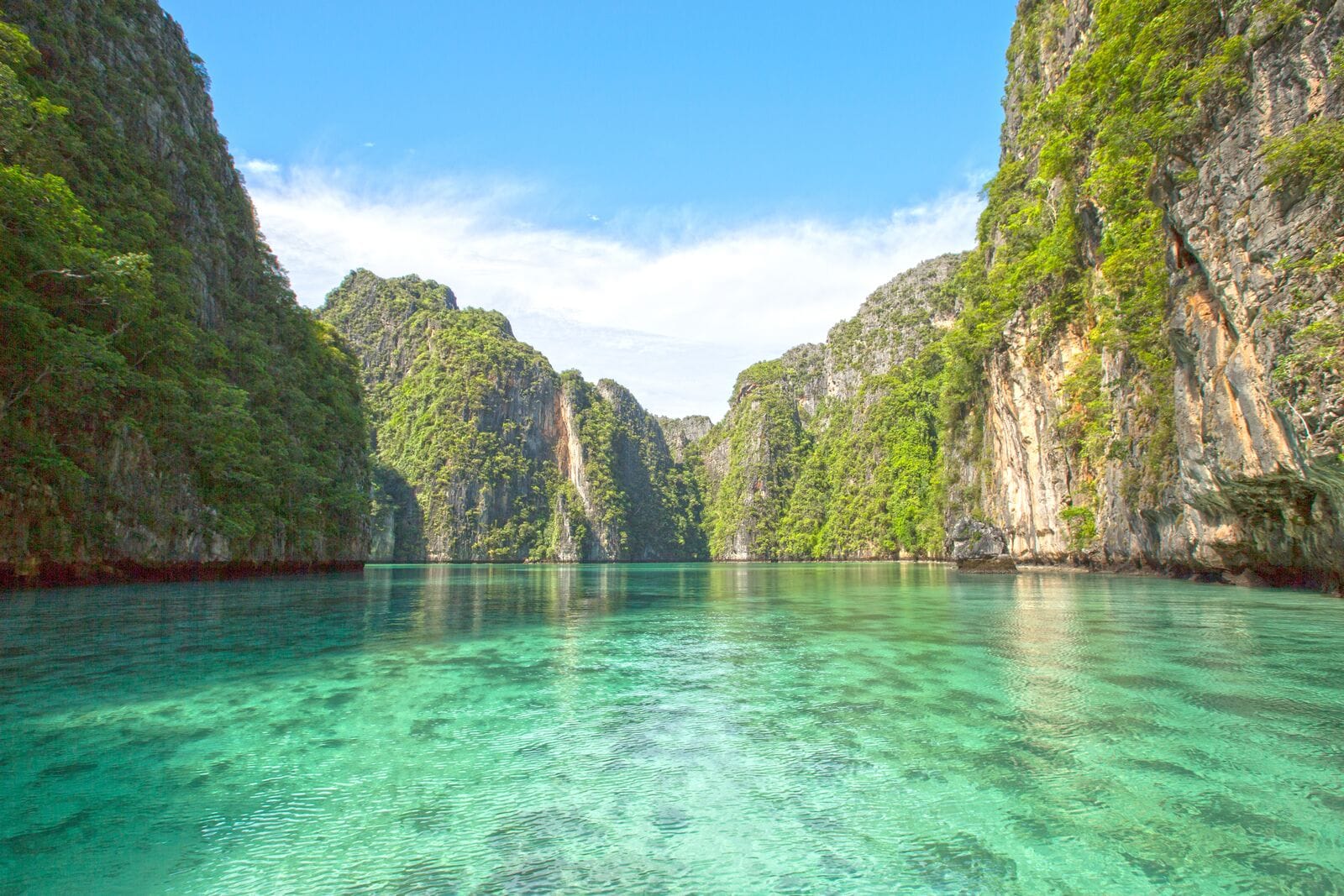 Emerald green water of Pileh Lagoon enclosed by steep limestone walls at Phi Phi Leh.