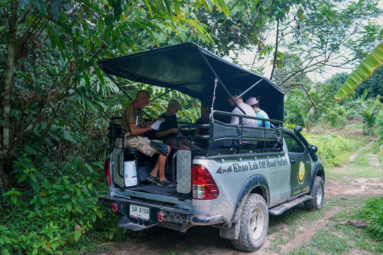 Khao Lak Expedition 4x4 safari truck with guests on a jungle track near Khao Lak